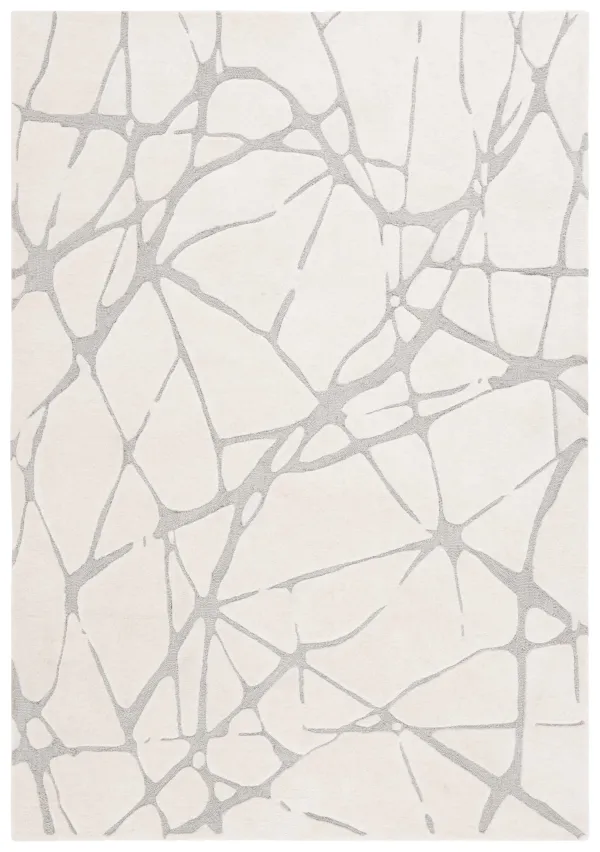 RODEO DRIVE Hand Tufted 5' x 8' area rug