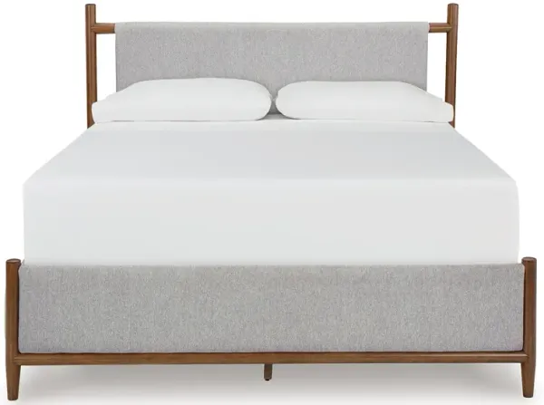 Lyncott Queen Upholstered Panel Bed