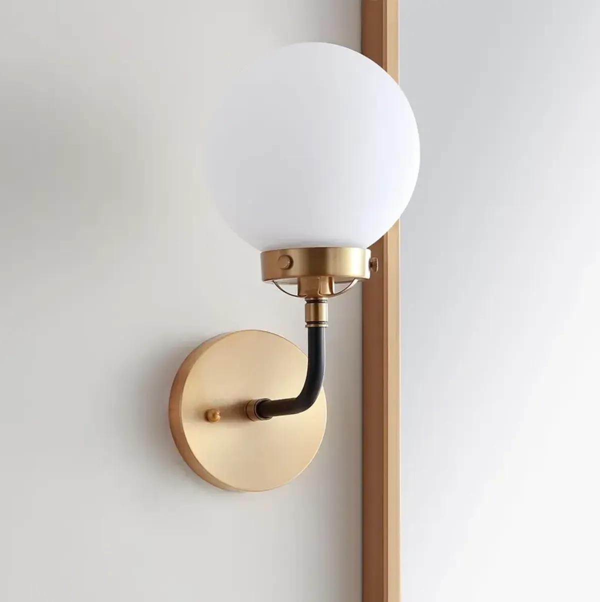 Haldrin Frosted Glass Globe Vanity Wall Sconce - Gold/Black