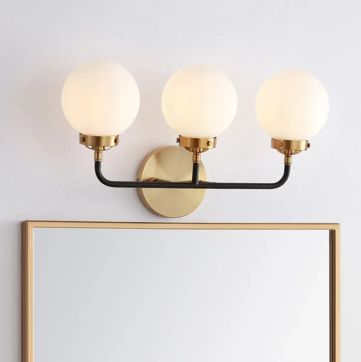 Haldrin Frosted Glass Globe Vanity Wall Sconce - Gold/Black