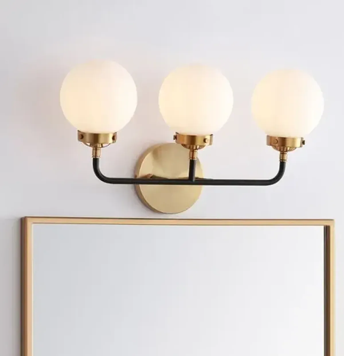Haldrin Frosted Glass Globe Vanity Wall Sconce - Gold/Black
