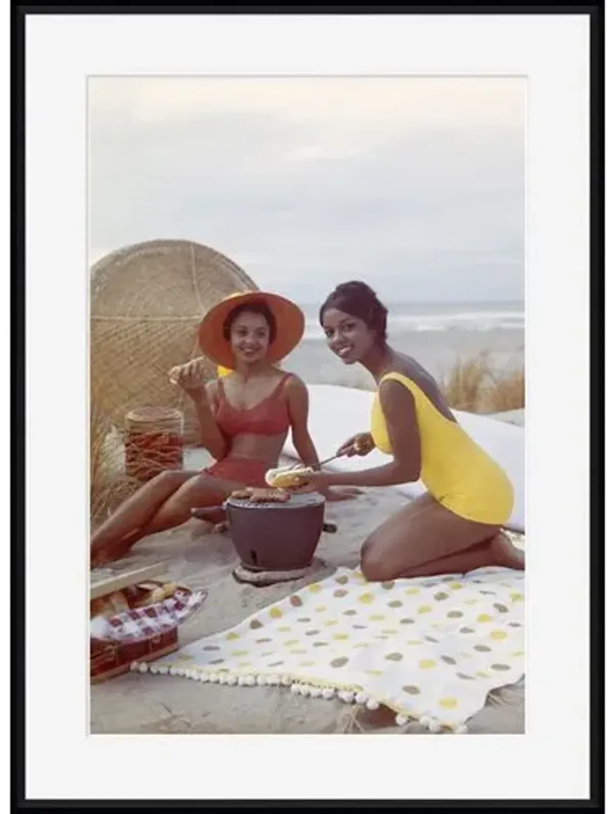 Tom Kelley - Young Women Holding Hot Dog on Beach - Black