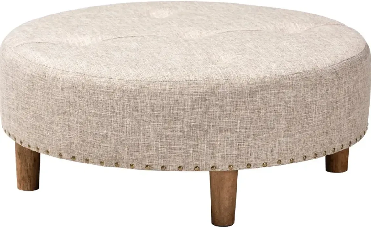 Vinet Beige Upholstered Round Cocktail Ottoman