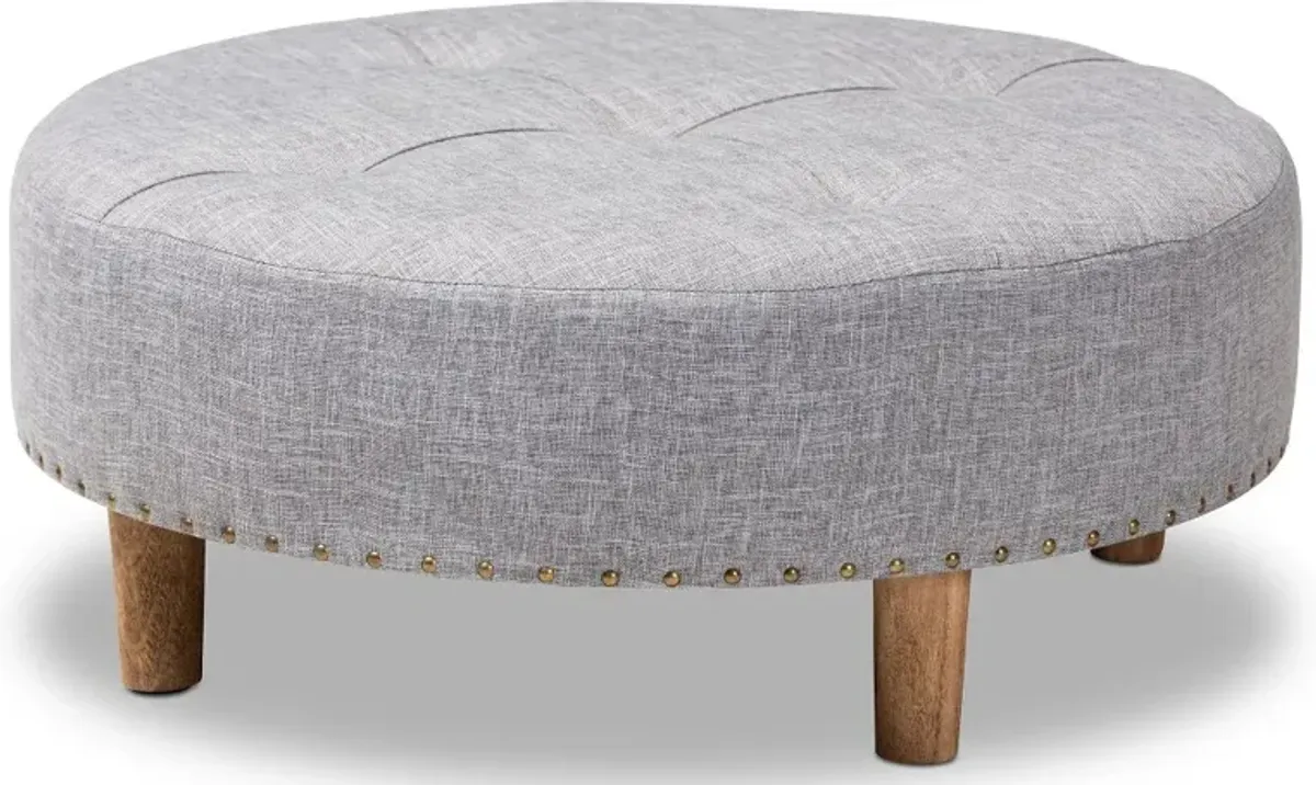 Vinet Gray Upholstered Round Cocktail Ottoman