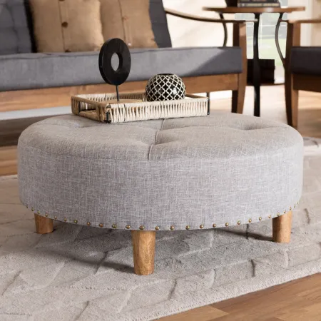 Vinet Gray Upholstered Round Cocktail Ottoman