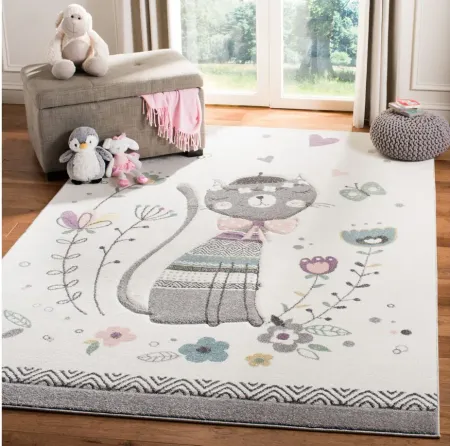 Carousel Cat Kids Area Rug in Ivory & Pink by Safavieh