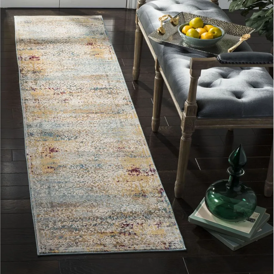 Alwine Area Rug in Yellow / Cream by Safavieh