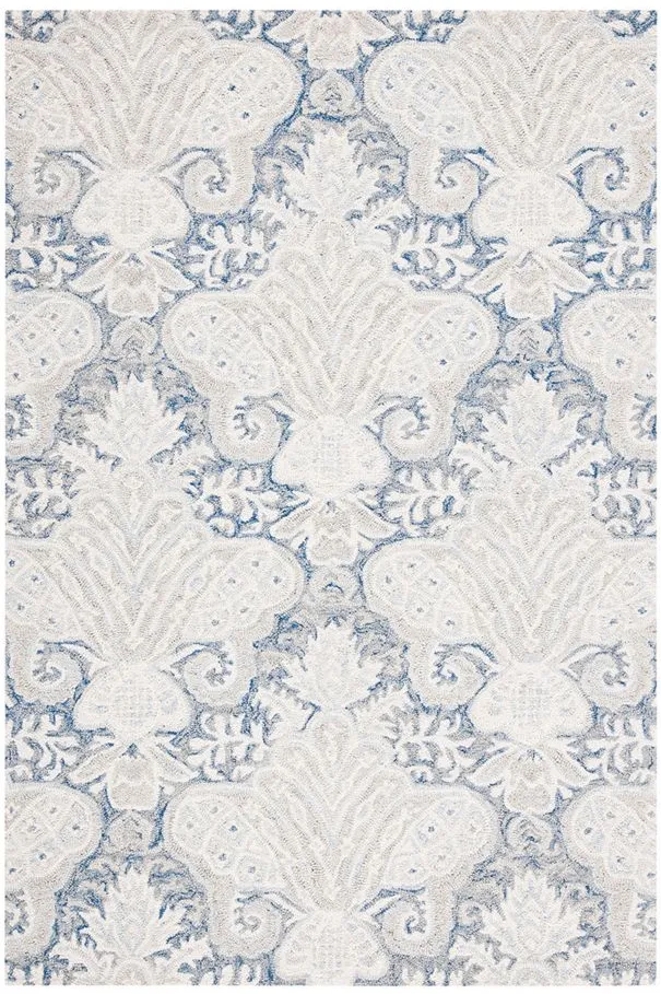 Nyneave Area Rug in Blue & Ivory by Safavieh