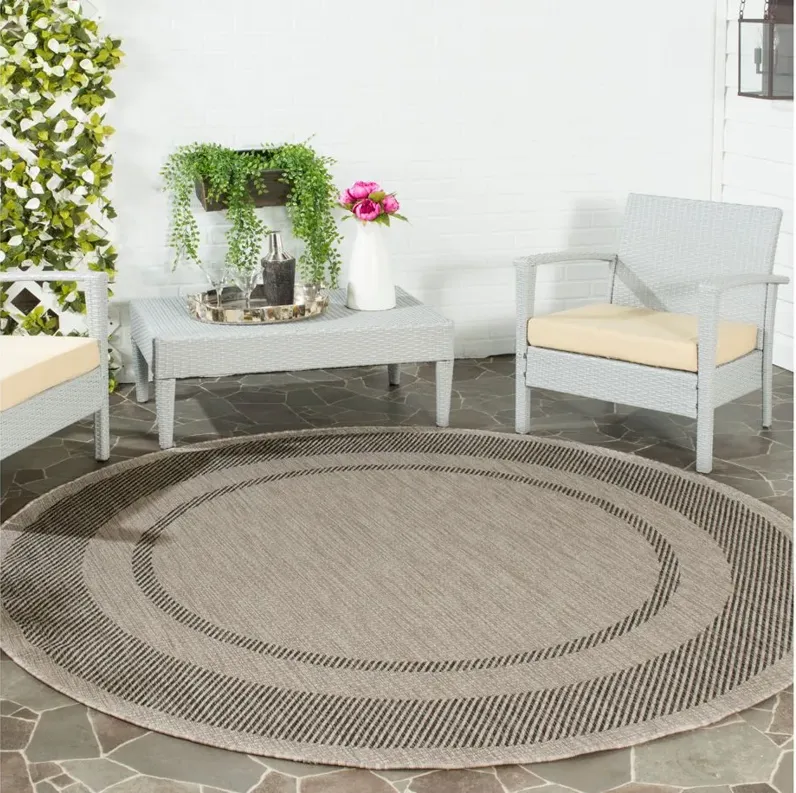 Courtyard Edging Indoor/Outdoor Area Rug Round in Beige & Black by Safavieh