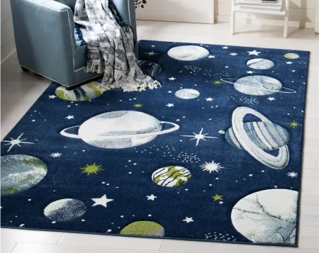 Carousel Planets Kids Area Rug in Navy & Ivory by Safavieh