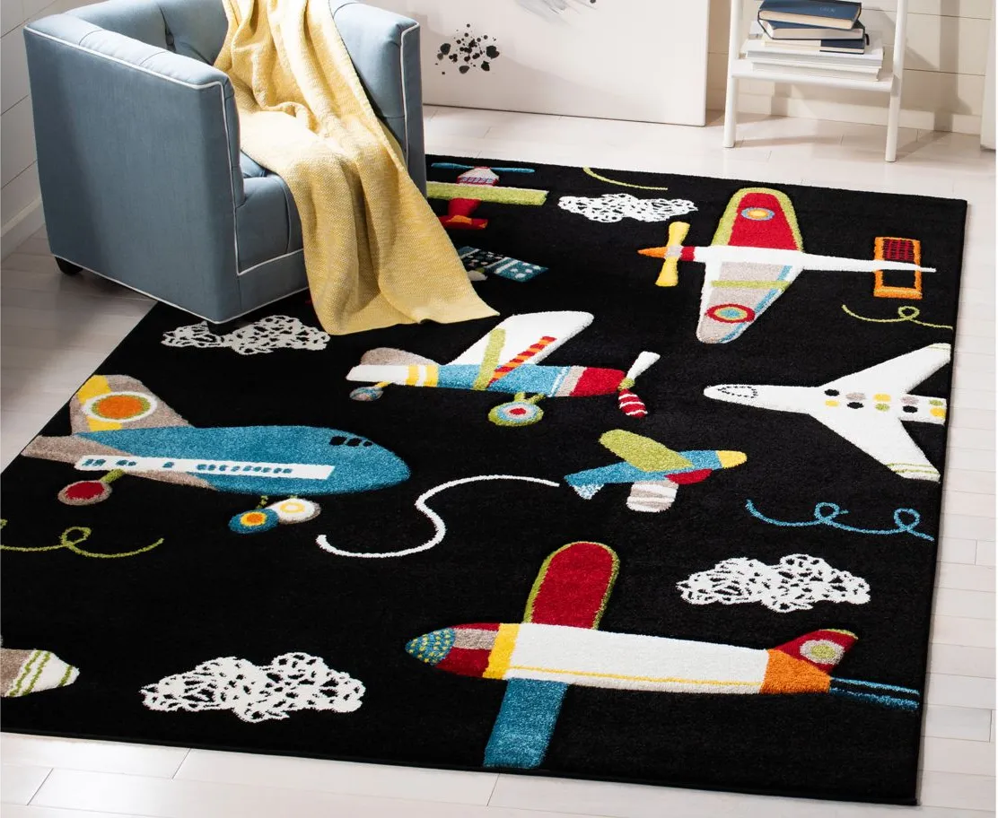 Carousel Planes Kids Area Rug in Black & Ivory by Safavieh