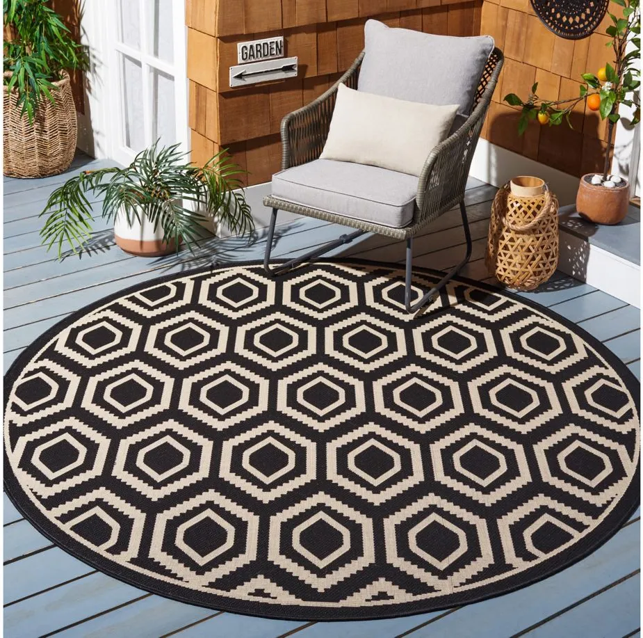 Courtyard Diamonds Indoor/Outdoor Area Rug Round in Black & Beige by Safavieh