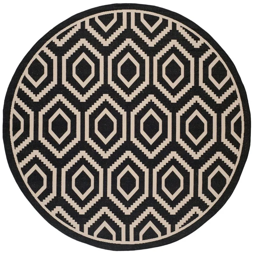 Courtyard Diamonds Indoor/Outdoor Area Rug Round in Black & Beige by Safavieh