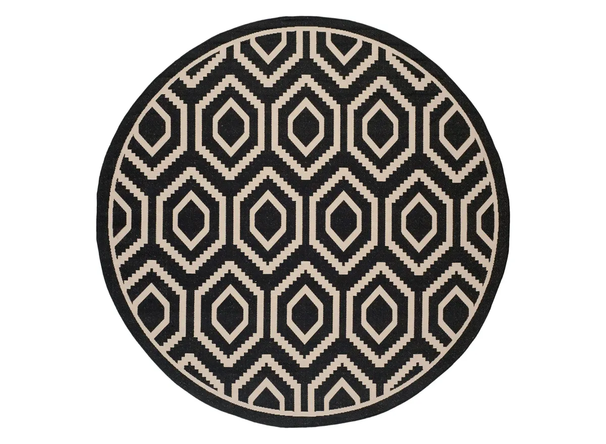 Courtyard Diamonds Indoor/Outdoor Area Rug Round in Black & Beige by Safavieh