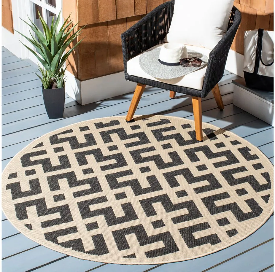 Courtyard Crossing Indoor/Outdoor Area Rug Round in Black & Beige by Safavieh