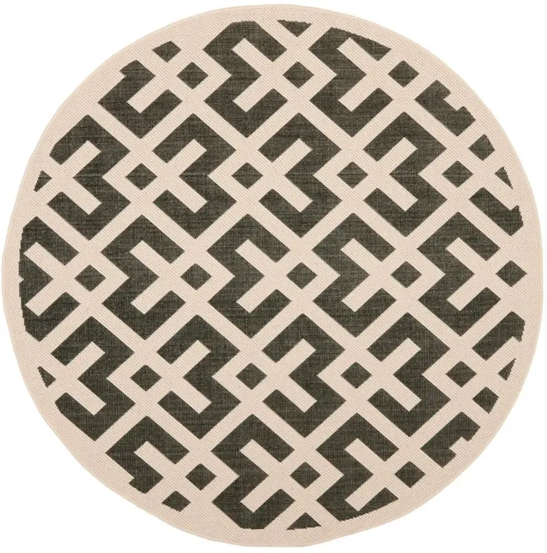 Courtyard Crossing Indoor/Outdoor Area Rug Round in Black & Beige by Safavieh