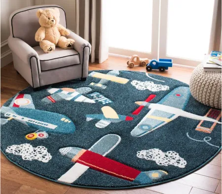 Carousel Planes Kids Area Rug Round in Navy & Ivory by Safavieh