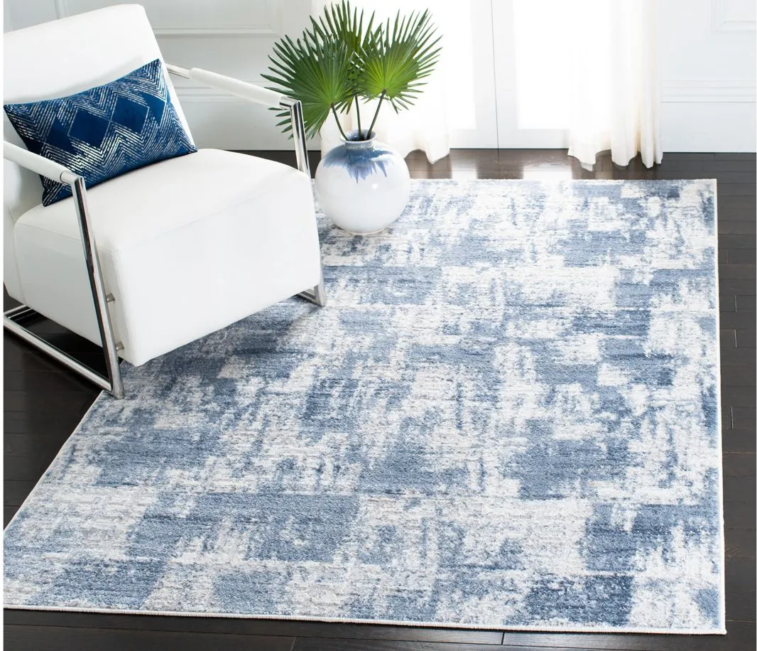 Amelia Area Rug in Ivory / Blue by Safavieh