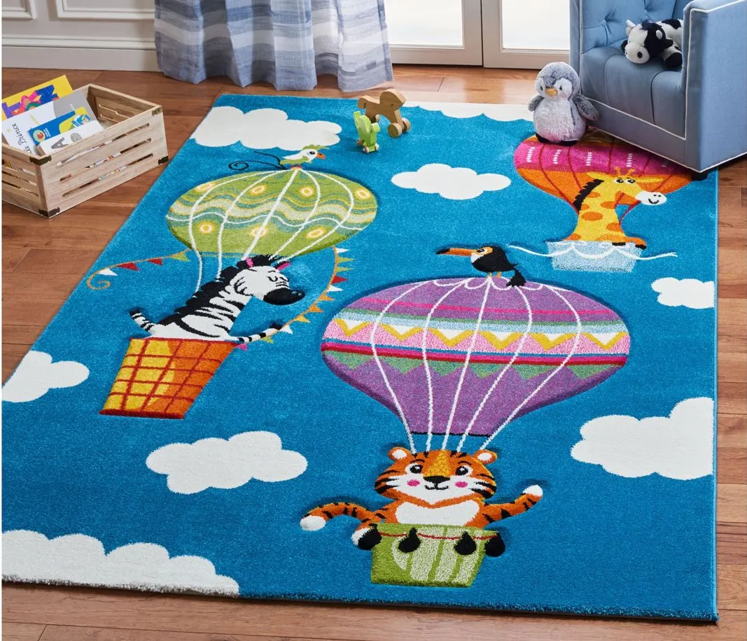 Carousel Balloons Kids Area Rug in Blue & Green by Safavieh