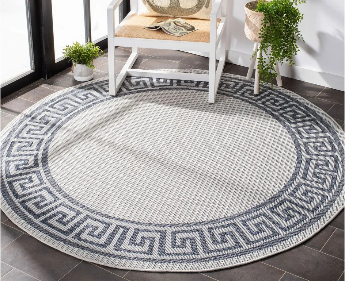 Bermuda Greek Key Indoor/Outdoor Round Area Rug in Ivory & Blue by Safavieh