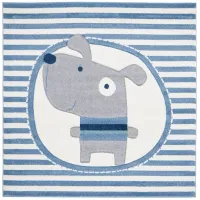 Carousel Puppy Kids Area Rug in Ivory & Blue by Safavieh