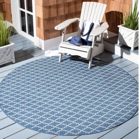 Courtyard Link Indoor/Outdoor Area Rug Round in Blue & Beige by Safavieh