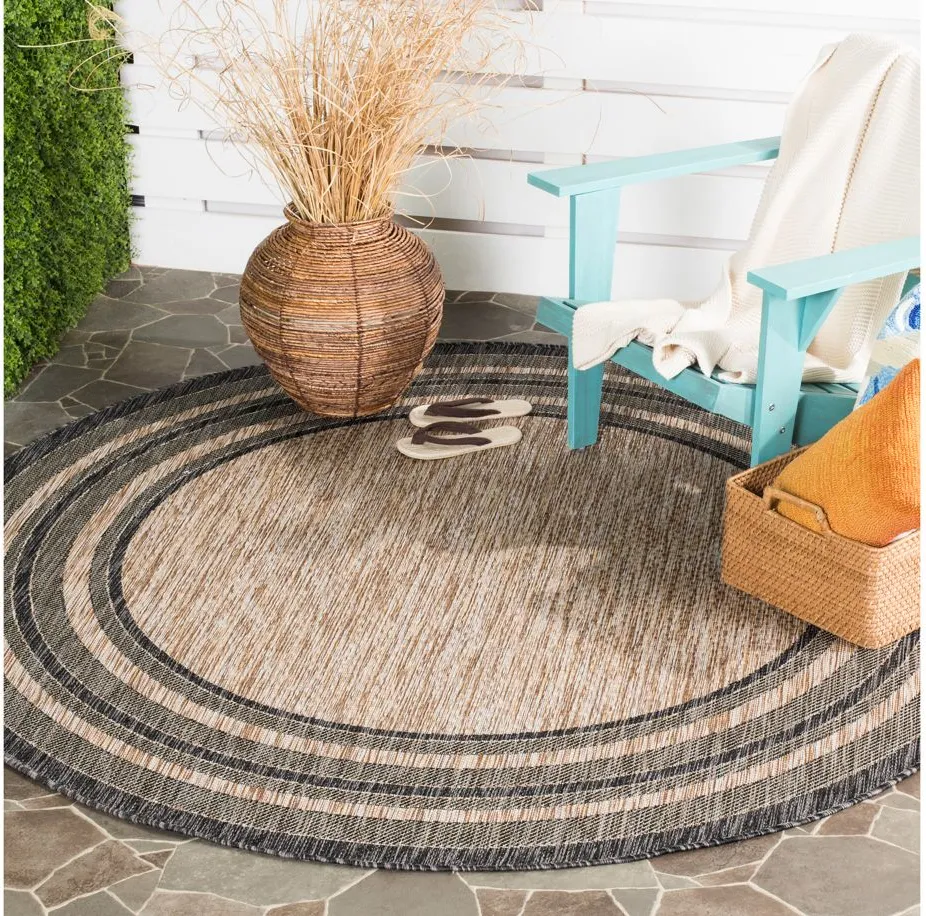 Courtyard Marches Indoor/Outdoor Area Rug Round in Natural & Black by Safavieh