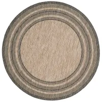 Courtyard Marches Indoor/Outdoor Area Rug Round in Natural & Black by Safavieh