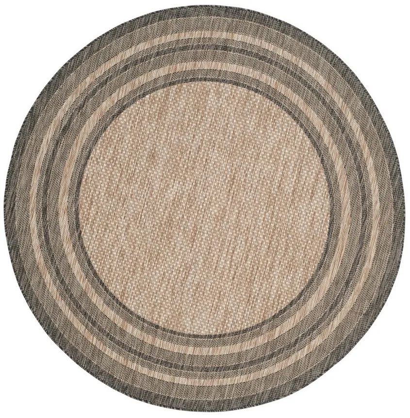 Courtyard Marches Indoor/Outdoor Area Rug Round in Natural & Black by Safavieh