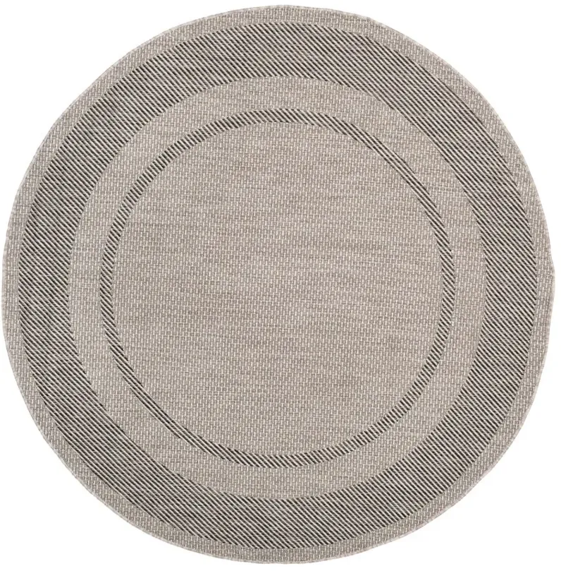 Courtyard Edging Indoor/Outdoor Area Rug Round in Beige & Black by Safavieh