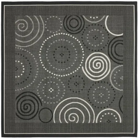 Courtyard Circles Indoor/Outdoor Area Rug in Black & Sand by Safavieh