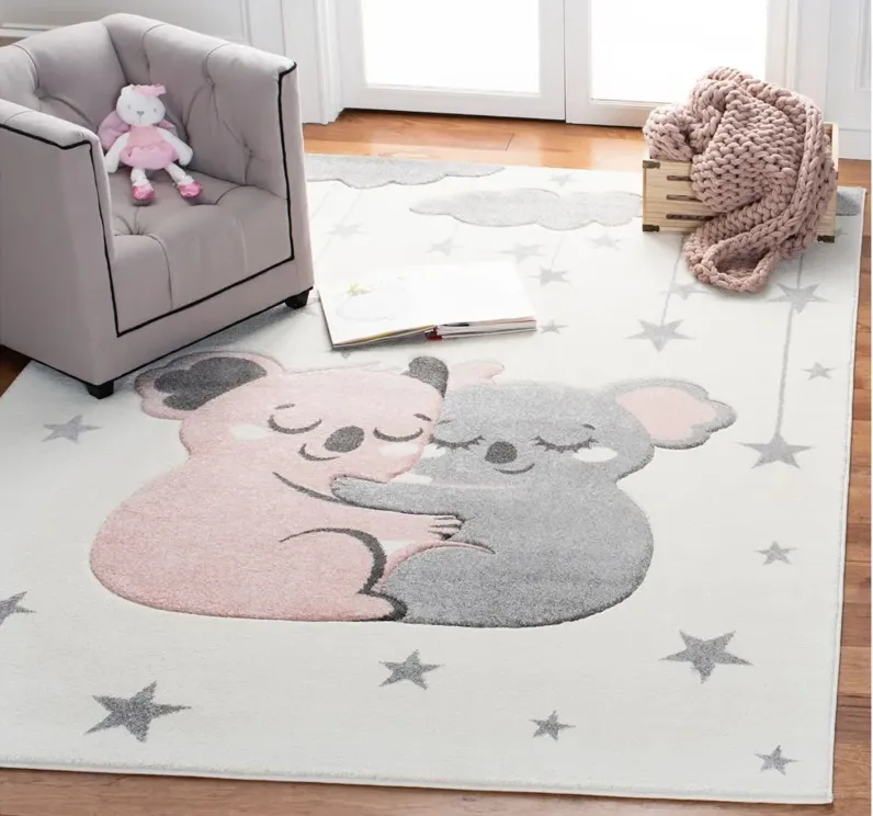 Carousel Koala Kids Area Rug in Ivory & Pink by Safavieh