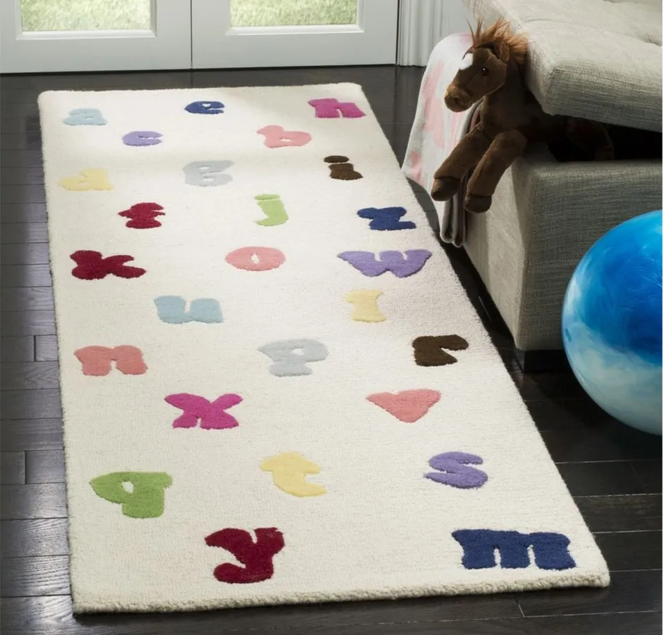 MacTavish Kid's Rug in Ivory/Multi by Safavieh