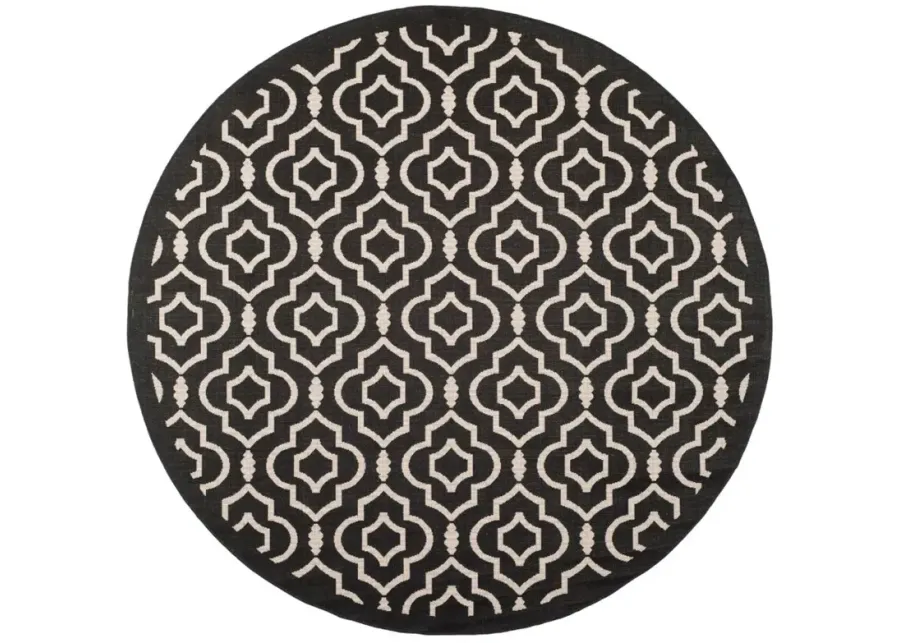 Courtyard Key Indoor/Outdoor Area Rug Round in Black & Beige by Safavieh