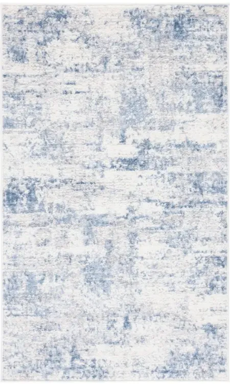 Amelia Area Rug in Ivory / Blue by Safavieh