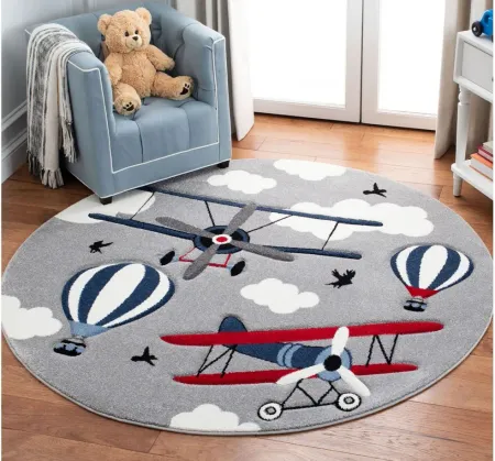 Carousel Airplanes Kids Area Rug Round in Light Gray & Red by Safavieh