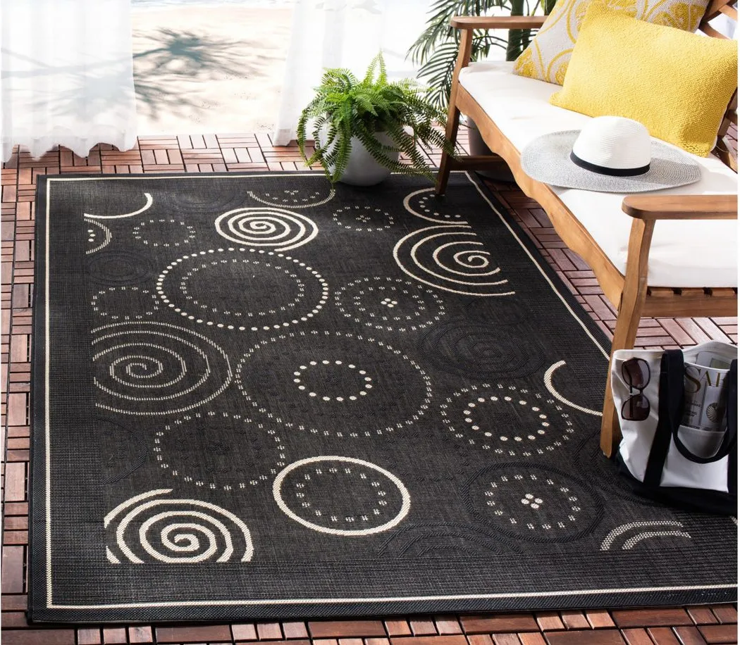 Courtyard Circles Indoor/Outdoor Area Rug in Black & Sand by Safavieh