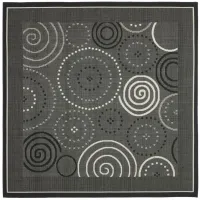 Courtyard Circles Indoor/Outdoor Area Rug in Black & Sand by Safavieh