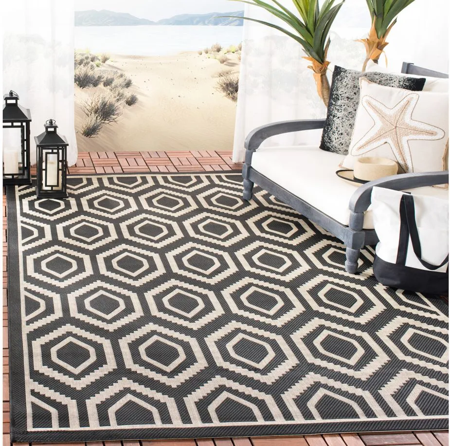 Courtyard Diamonds Indoor/Outdoor Area Rug in Black & Beige by Safavieh