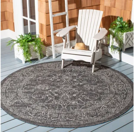 Courtyard Pacific Indoor/Outdoor Area Rug Round in Black & Ivory by Safavieh