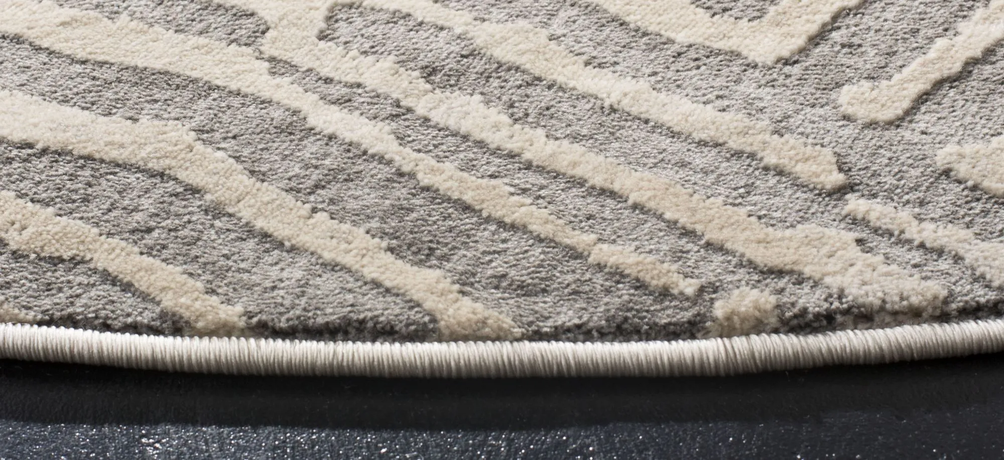 Vartanian Round Area Rug in Taupe by Safavieh