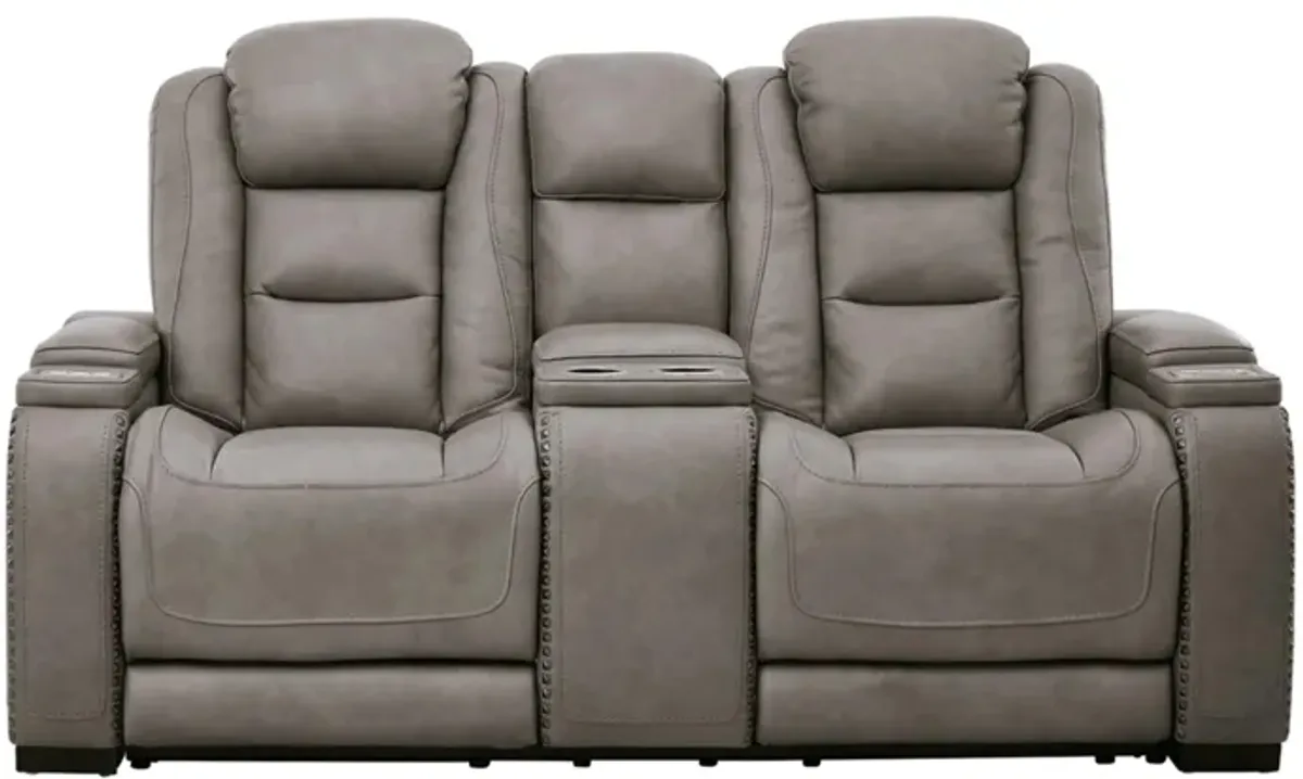 The Man-Den Power Recliner Loveseat with Console and Adjustable Headrest in Gray by Ashley Furniture