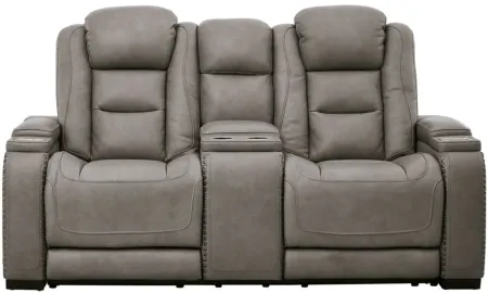 The Man-Den Power Recliner Loveseat with Console and Adjustable Headrest in Gray by Ashley Furniture