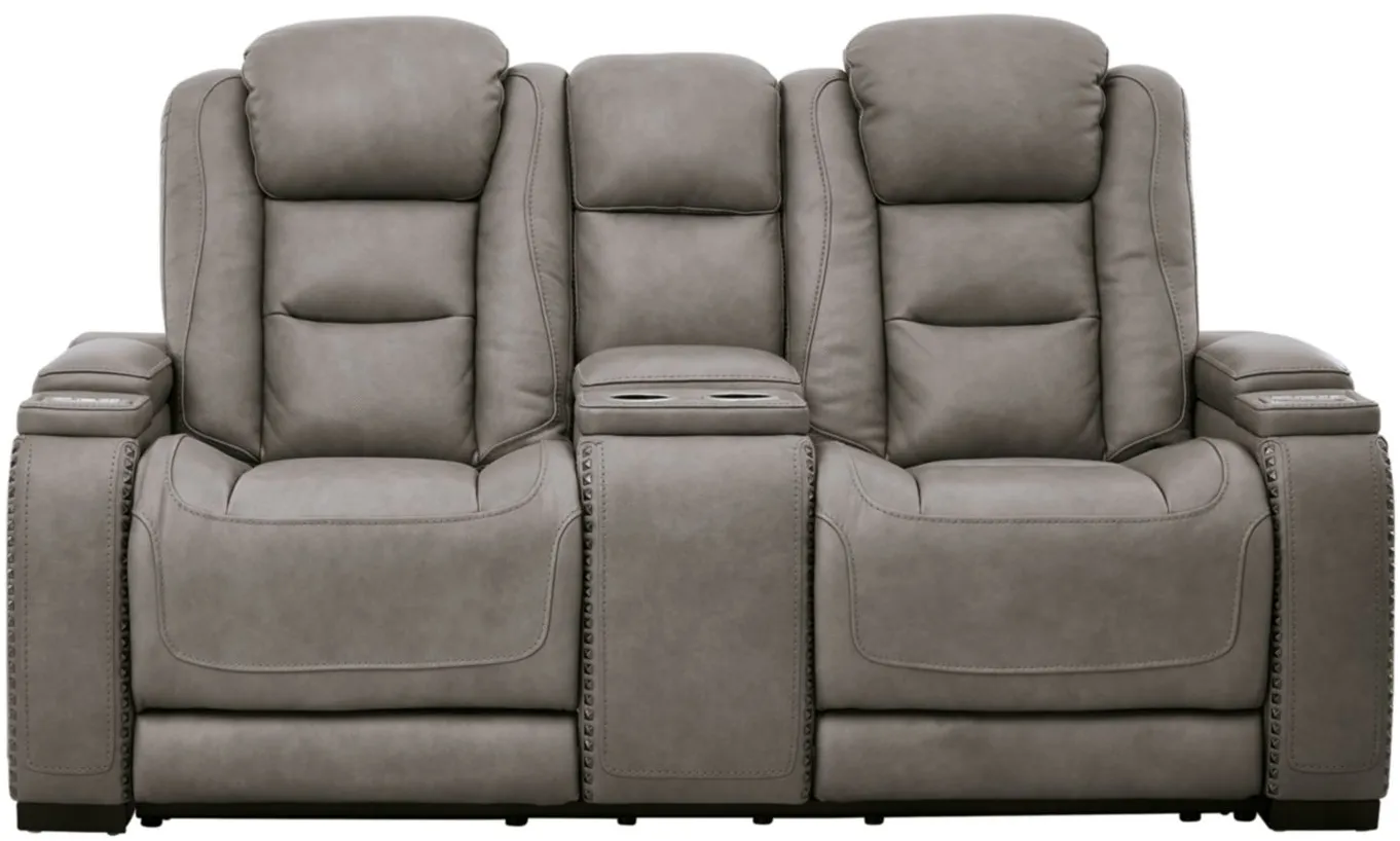 The Man-Den Power Recliner Loveseat with Console and Adjustable Headrest in Gray by Ashley Furniture