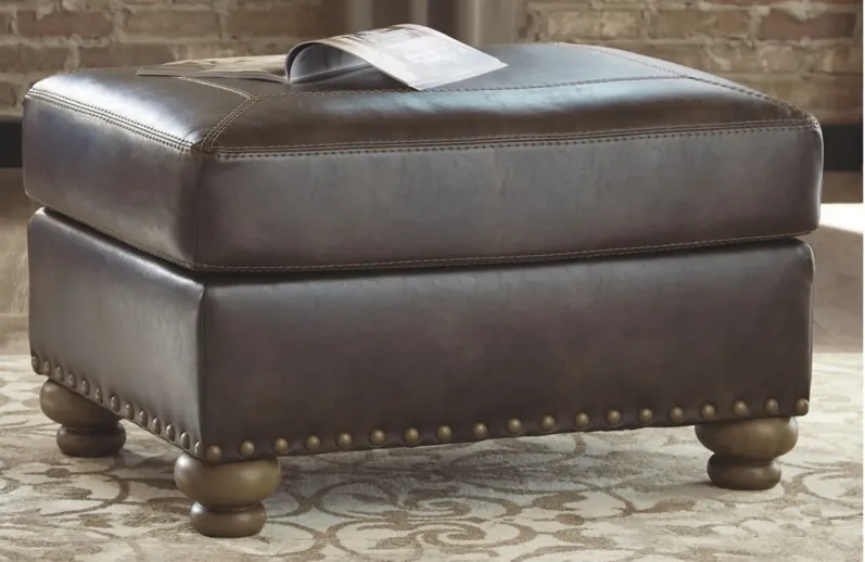 Navarra Ottoman in Coffee by Ashley Furniture