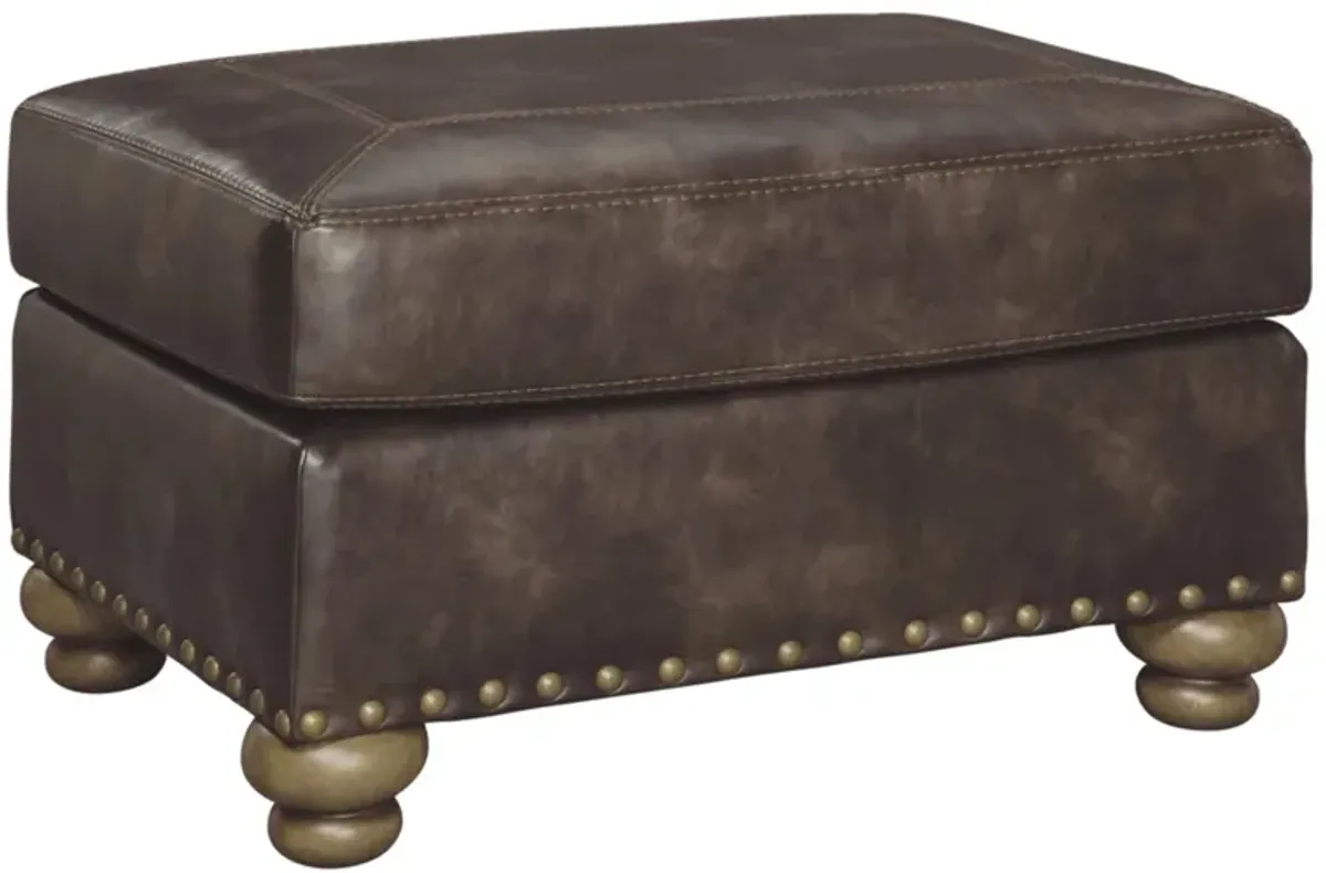 Navarra Ottoman in Coffee by Ashley Furniture