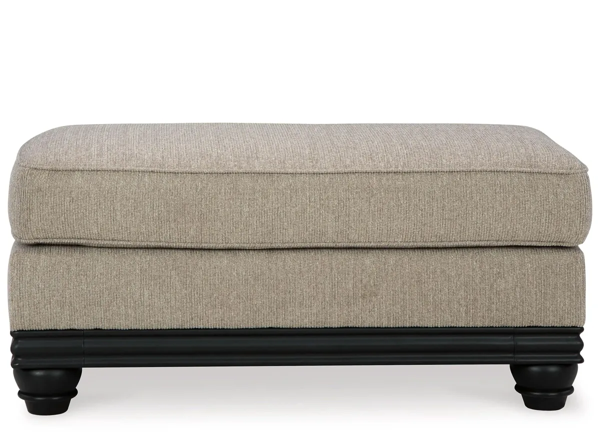 Elbiani Ottoman in Alloy by Ashley Furniture