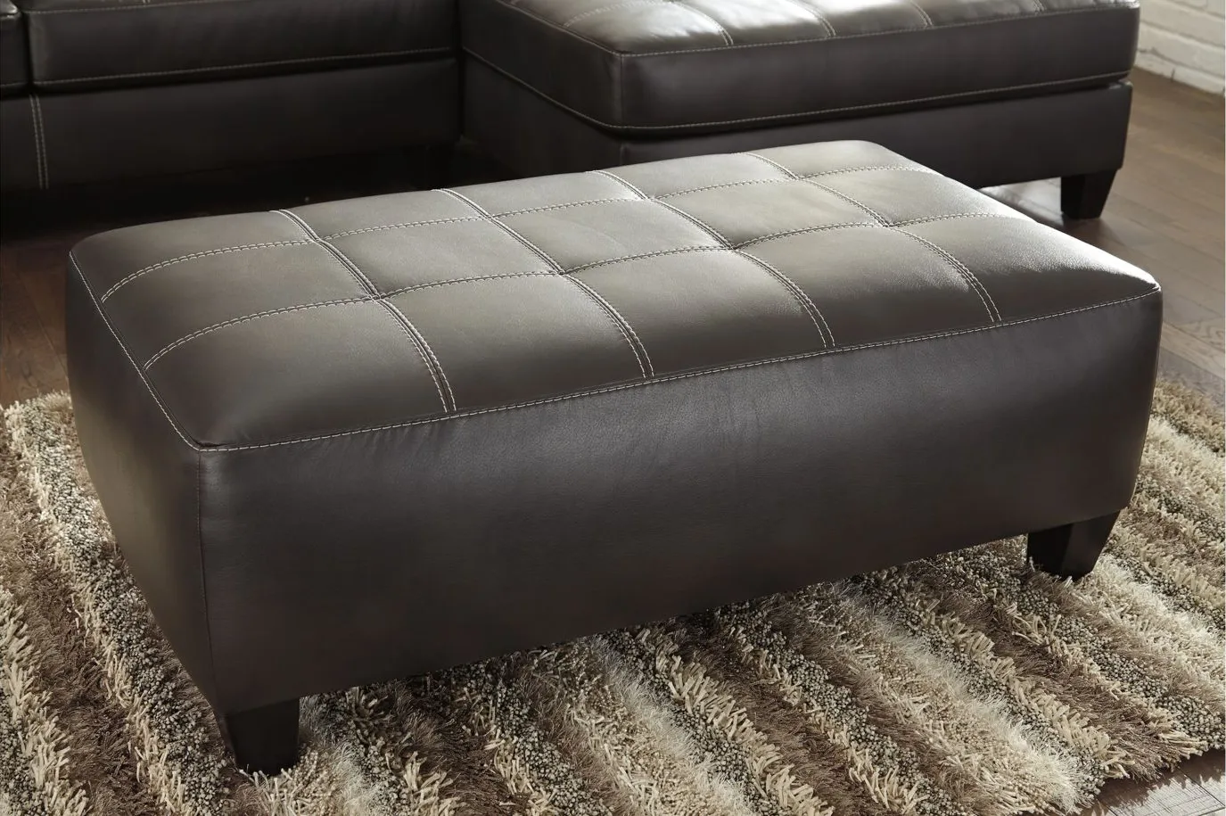 Nokomis Oversized Accent Ottoman in Charcoal by Ashley Furniture