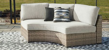 Calworth Outdoor Curved Loveseat in Brown by Ashley Furniture
