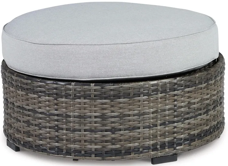 Harbor Court Ottoman with Cushion in Gray by Ashley Furniture